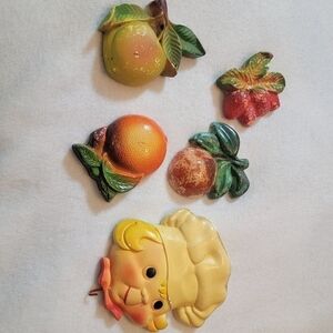Vintage plaster wall hangings. Fruit and a chef with a hook to hang something